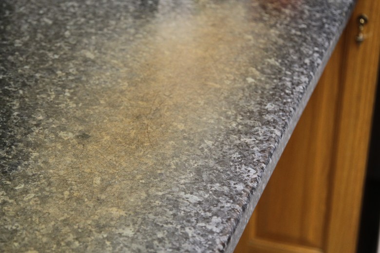 Worn and stained worksurface