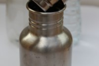 Refillable water bottle with plastic bottles in the background