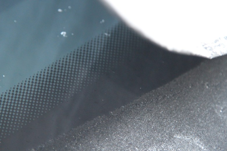 Clear glass under blanket on icy day