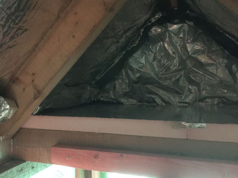 Installation of foil-faced phenolic insulation board above dormer ceiling